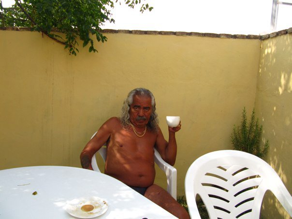 Freddie drinking coffee in our yard