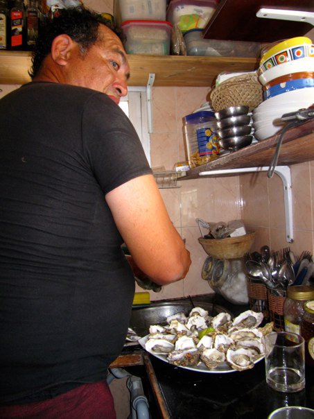 Hector shucking oysters